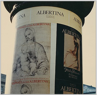 At the entrance to the Albertina, Vienna, the column displaying the posters announcing the museum's exhibitions "Raphael in der Albertina" and "Stanley Roseman - Zeichnungen aus Klostern," 1983. Photo  Ronald Davis